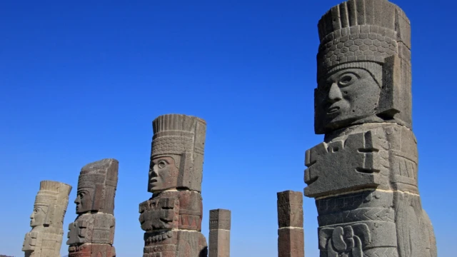 Toltec warriors columns topping the pyramid of Quetzalcoatl in Tula